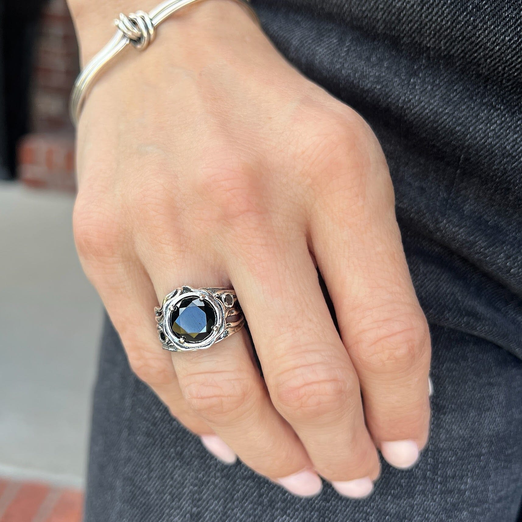 chunky silver designer ring featuring three round black cz stones