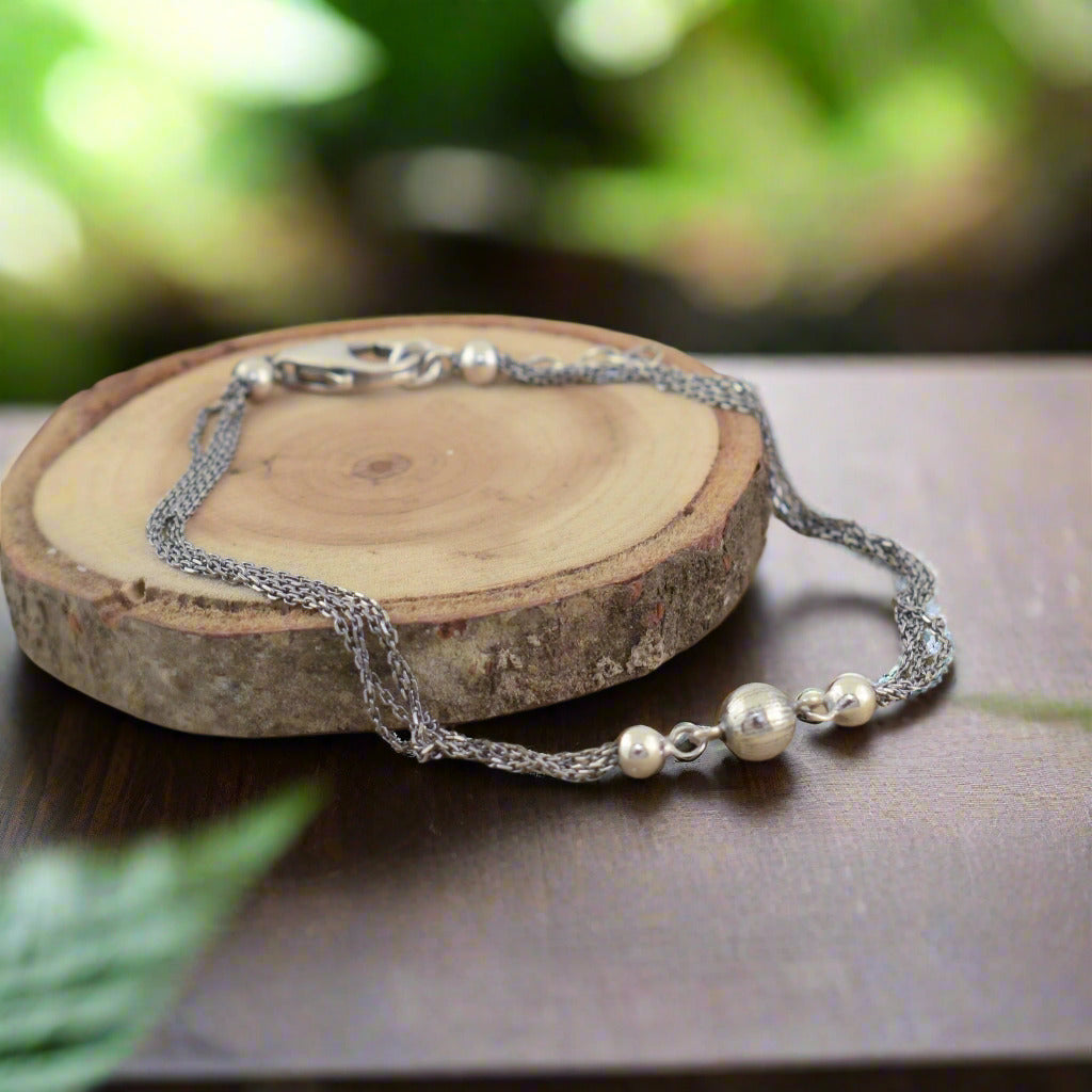 Trendy multi-chain sterling silver bracelet with high polished beaded accents