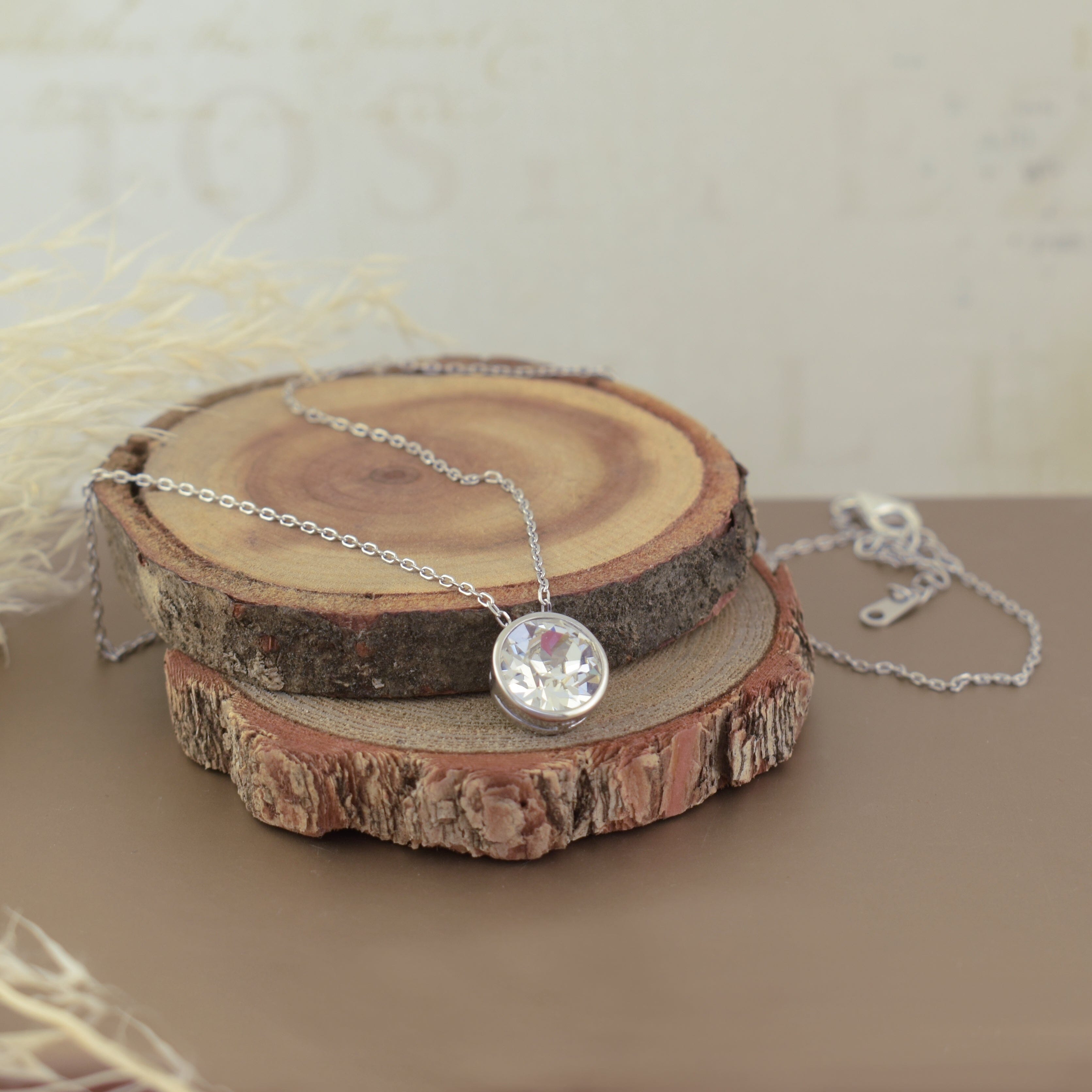 delicate sterling silver necklace featuring a large bezel-set austrian crystal pendant