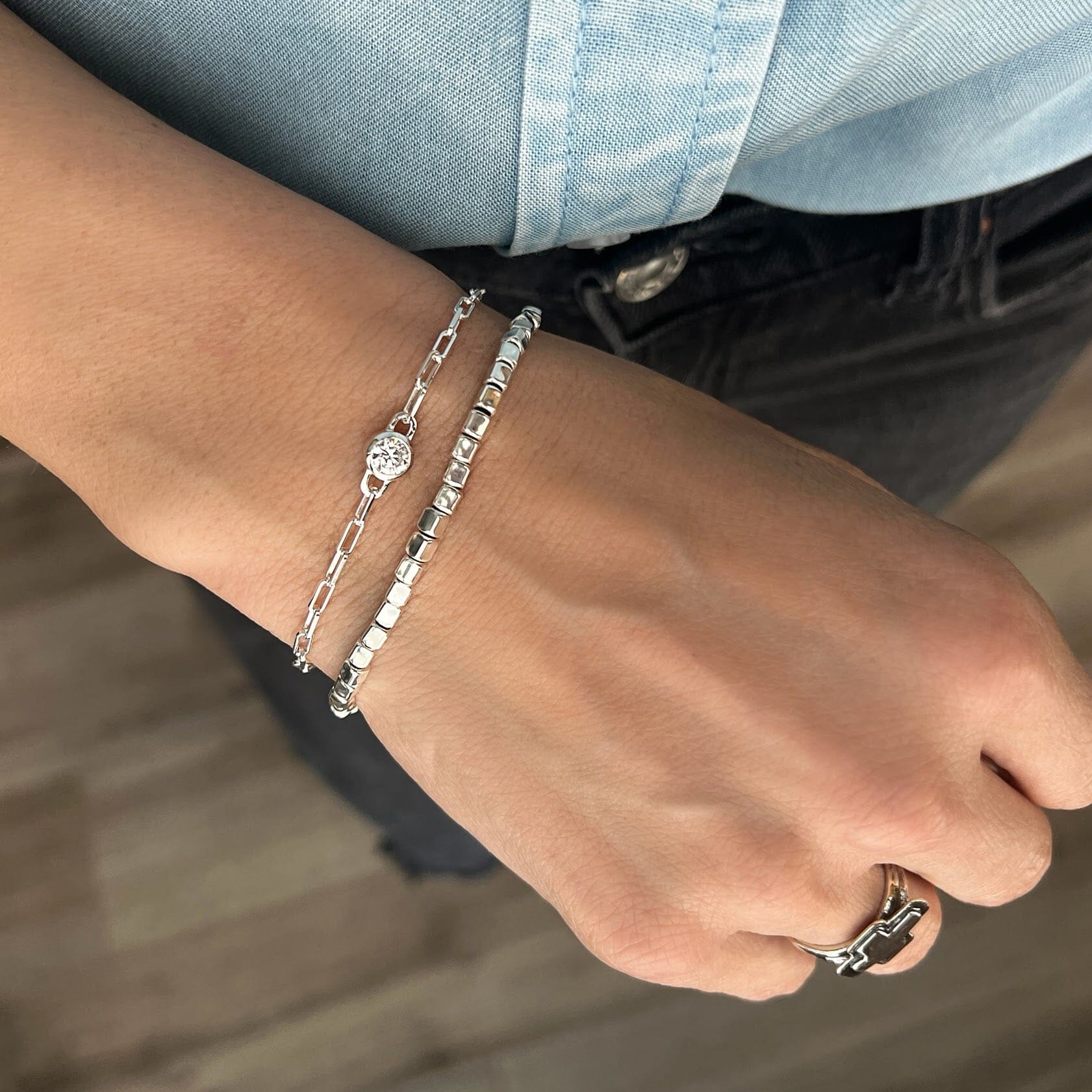 silver cube-shaped beaded bracelet paired with minimalist style paperclip bracelet with a center cz stone