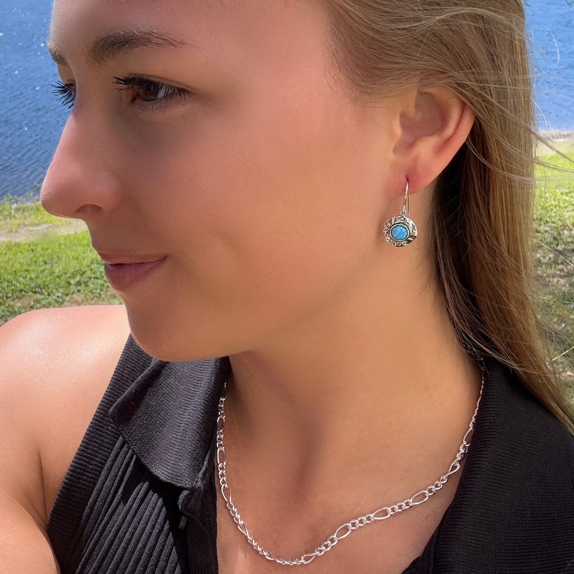 round opal stone in set around handcrafted silver paired with fab figaro