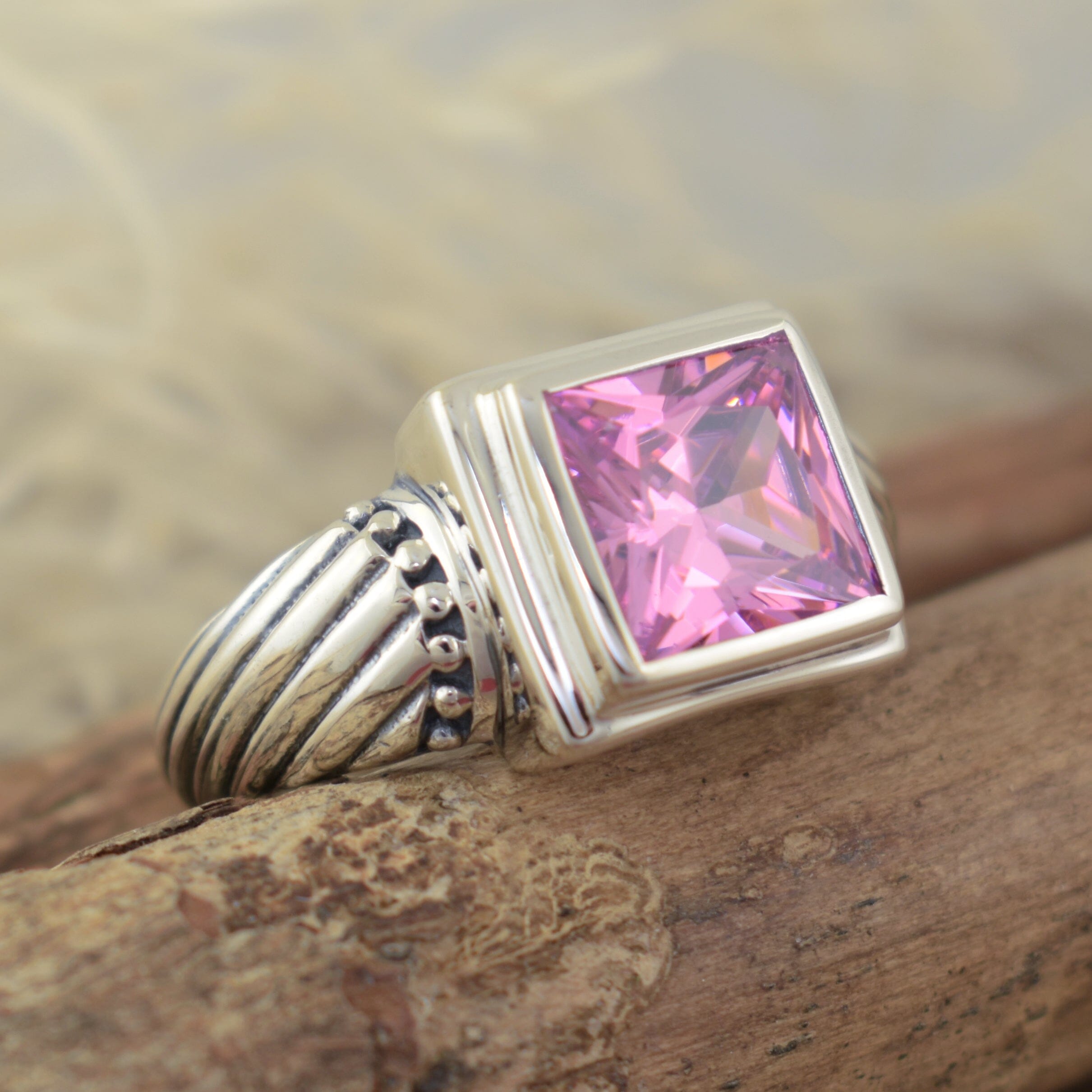 high polished sterling silver ring with square pink cz center