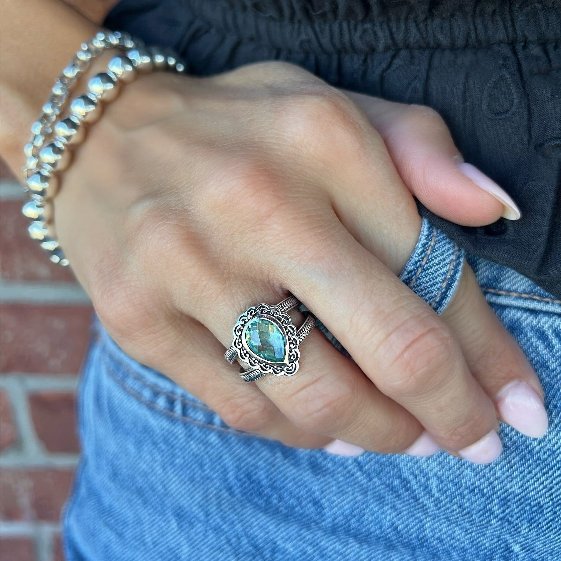 sterling silver ring with a pear shaped stone and a unique design around the stone, Queen Anne's lace ring.
