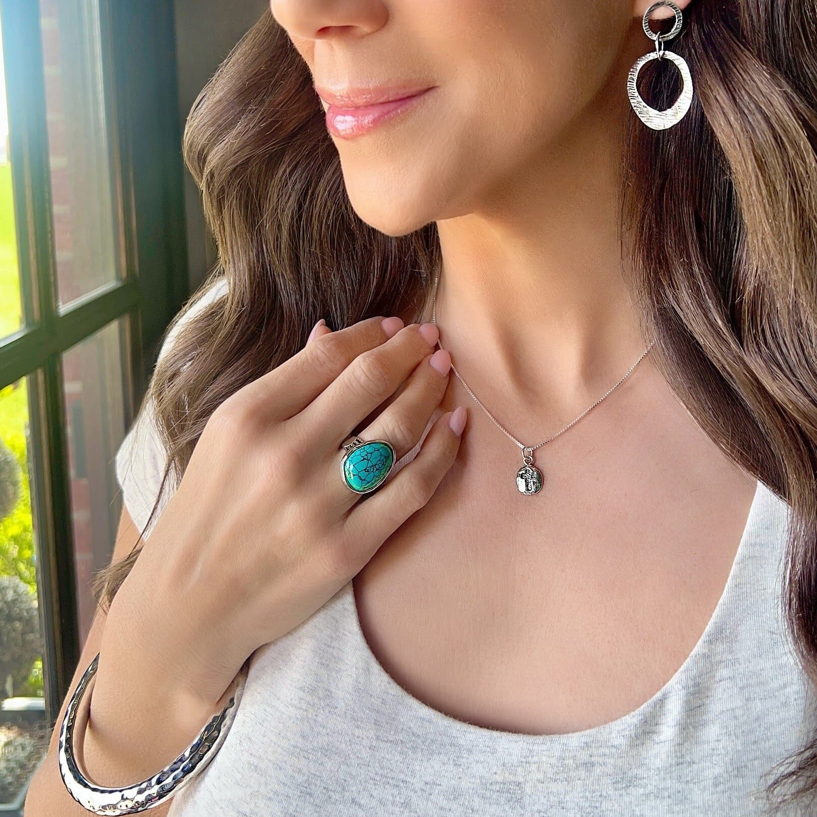 Rio Grande Ring featured with Falling Streams Earrings, Keeper of Faith Necklace, and Hammered Bliss Bangle