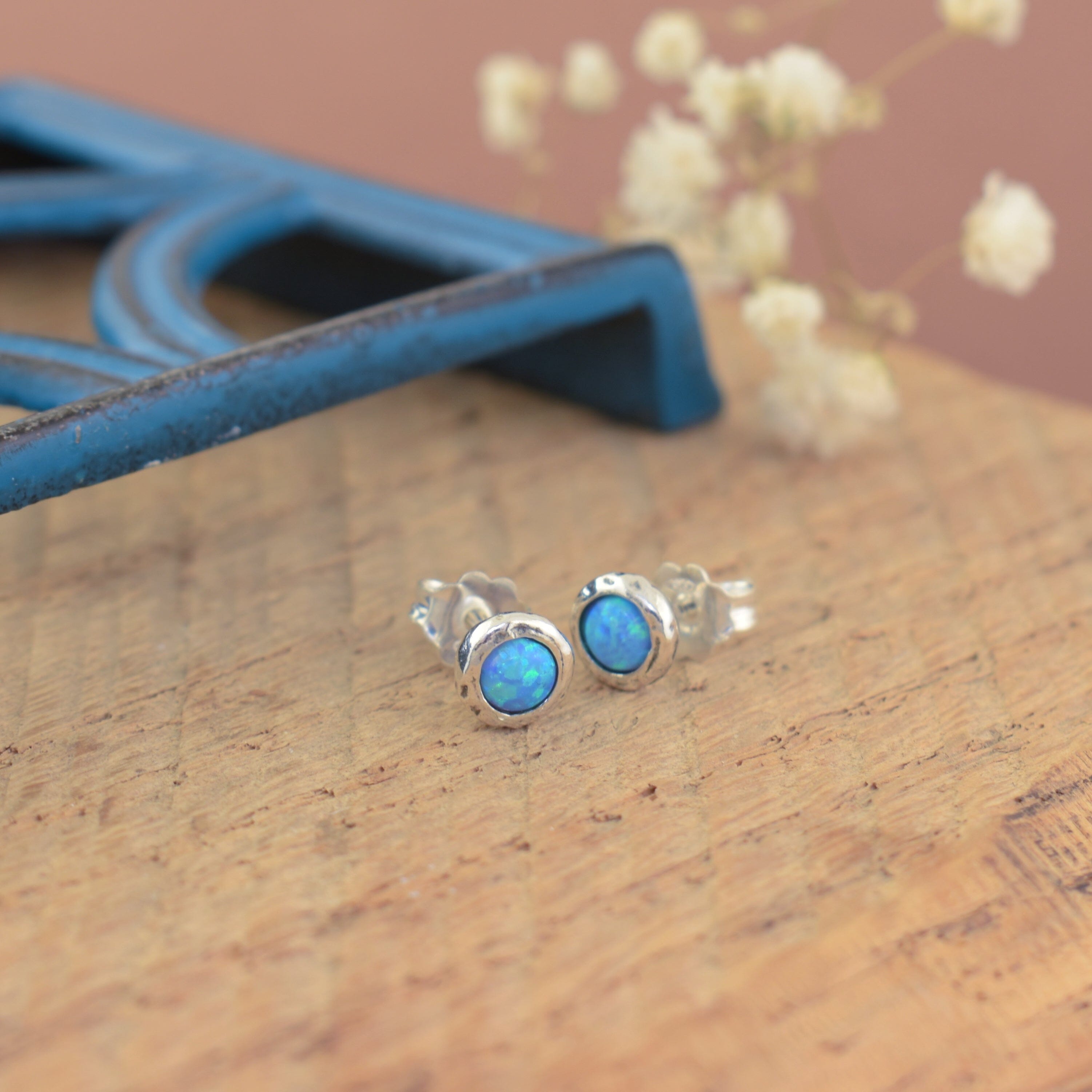 .925 sterling silver stud earrings with blue-green round stone