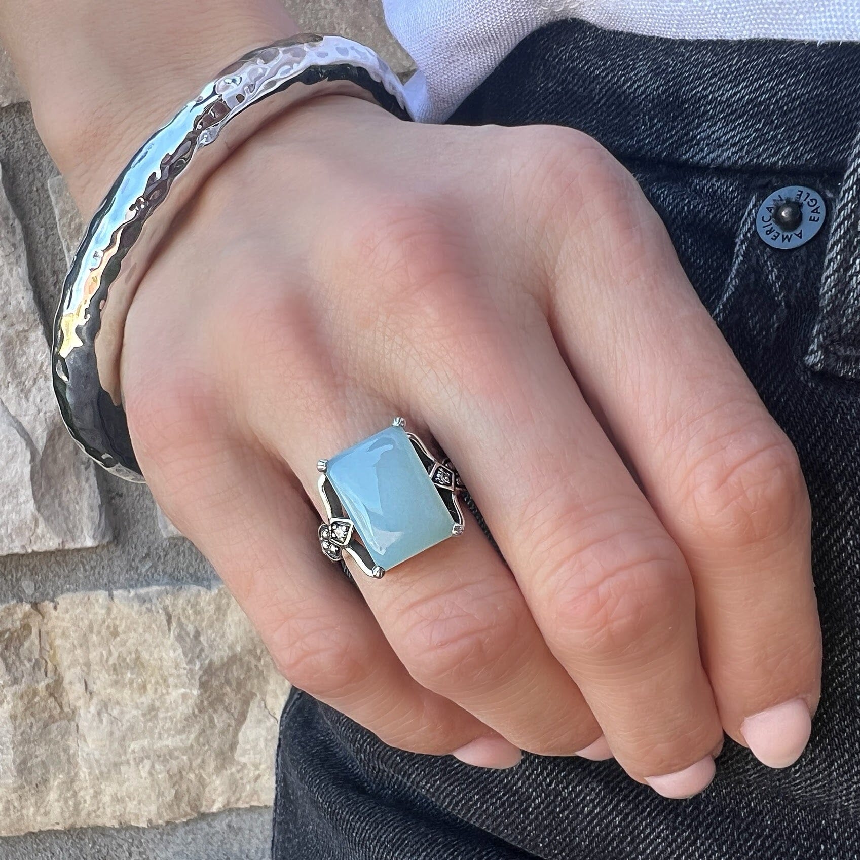 rectangular prong-set chalcedony ring with CZ stones on each side