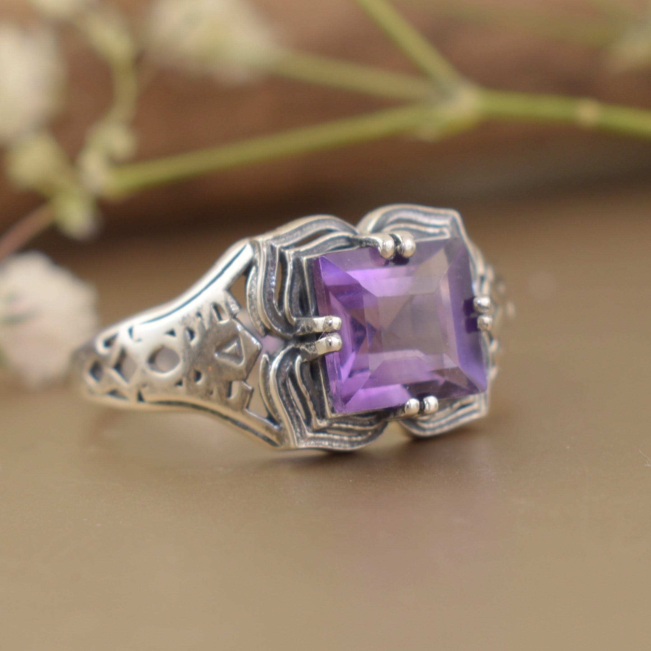 timeless vintage style ring featuring prong set square cut amethyst