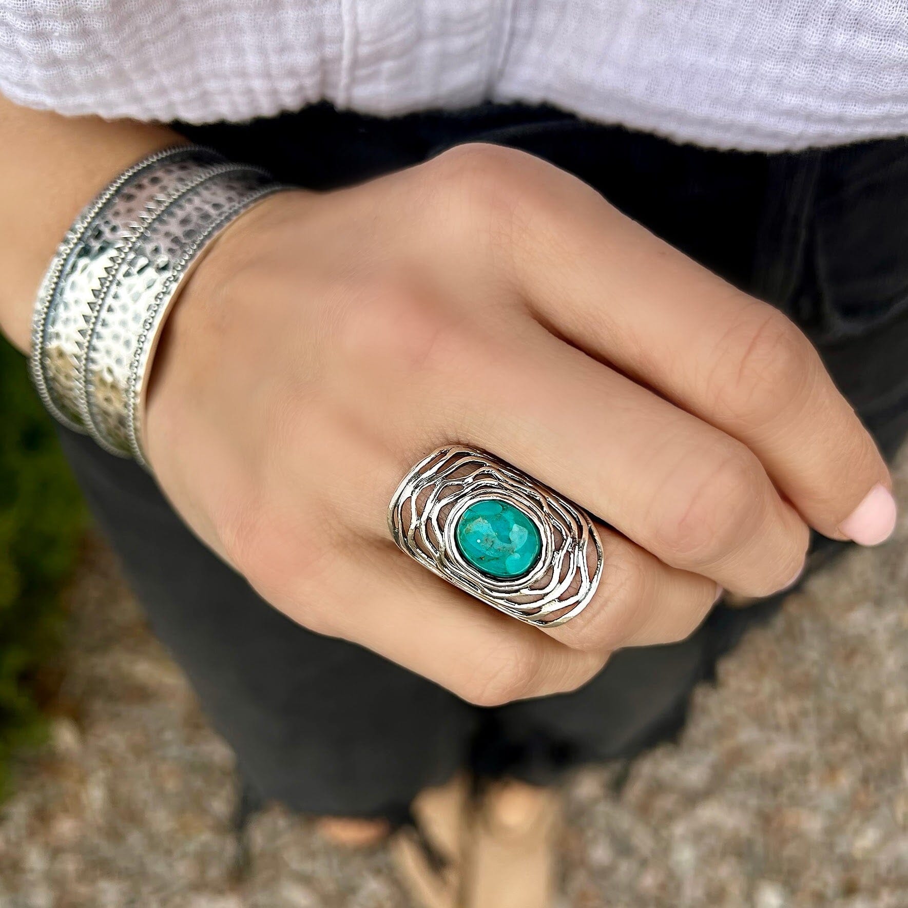 chunky sterling silver ring with a Reconstructed Turquoise stone in the center