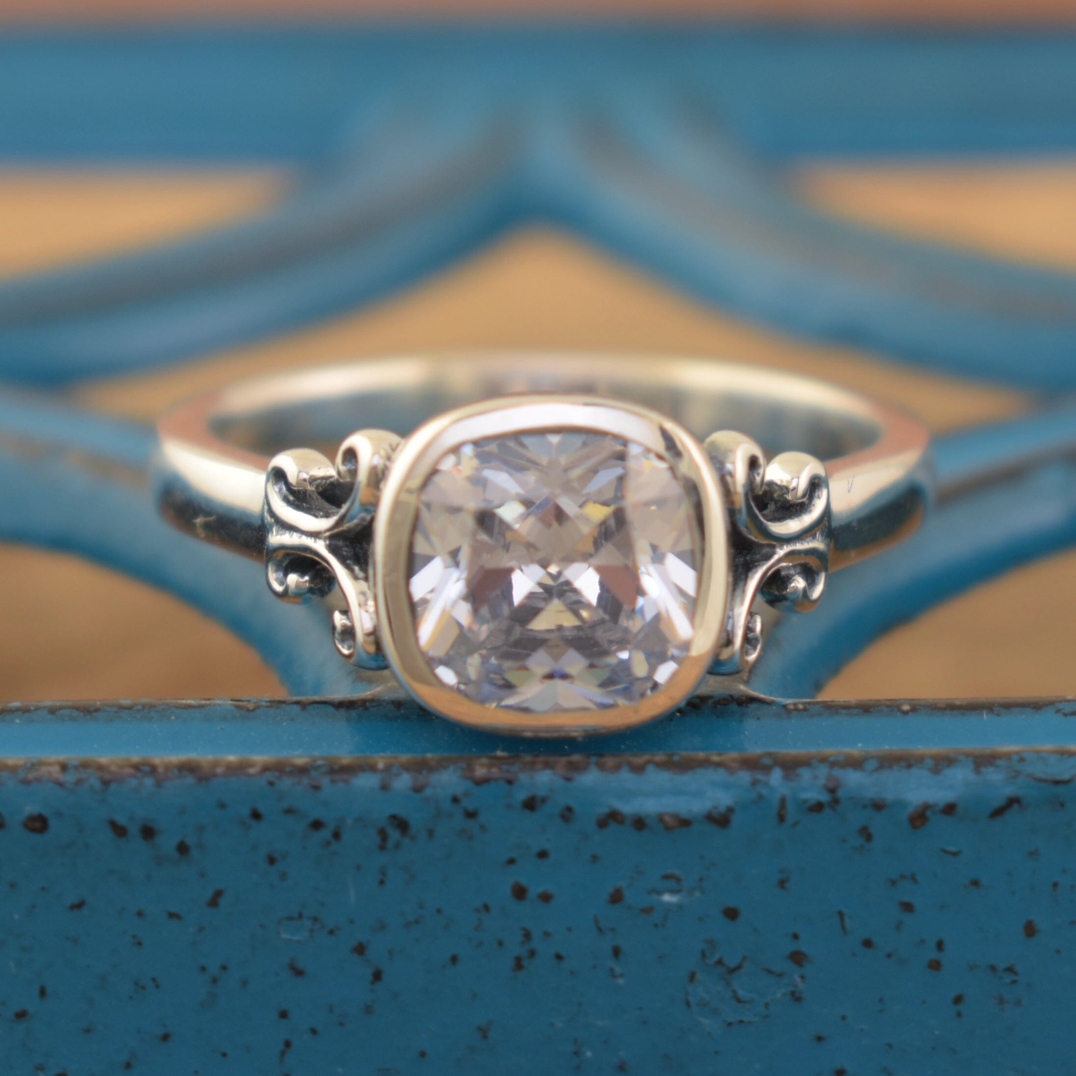 .925 sterling silver ring with bezel-set cushion cut cubic zirconia stone