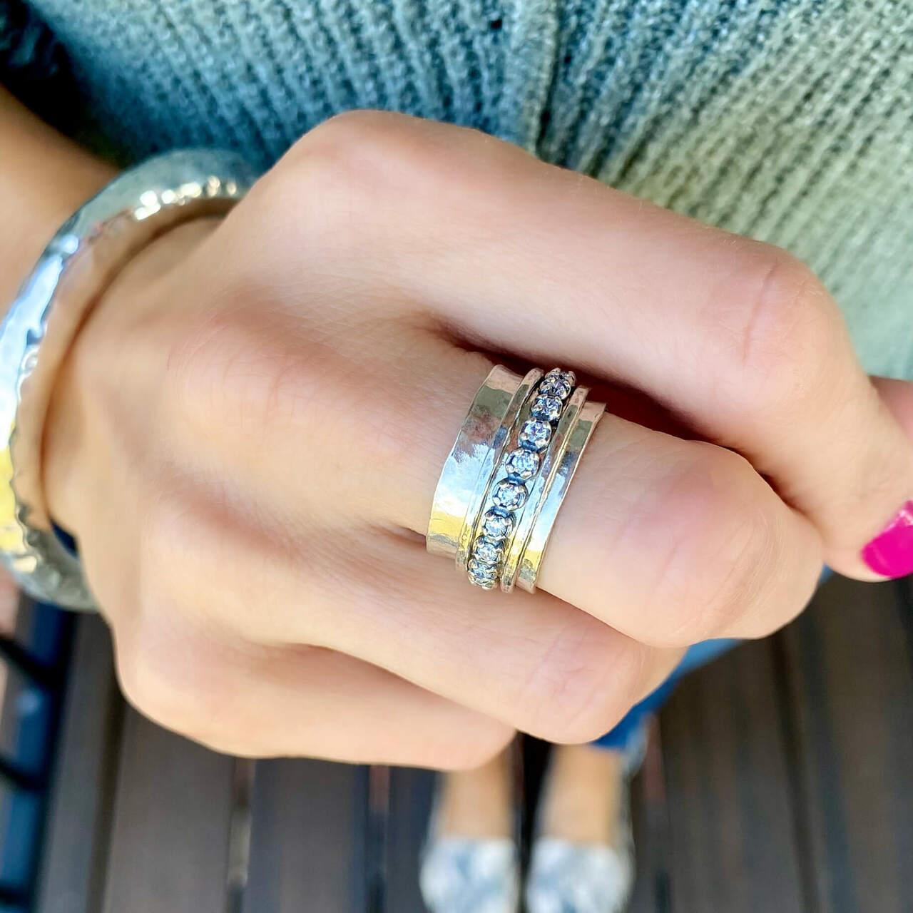 hammered sterling silver spinner ring with cubic zirconia