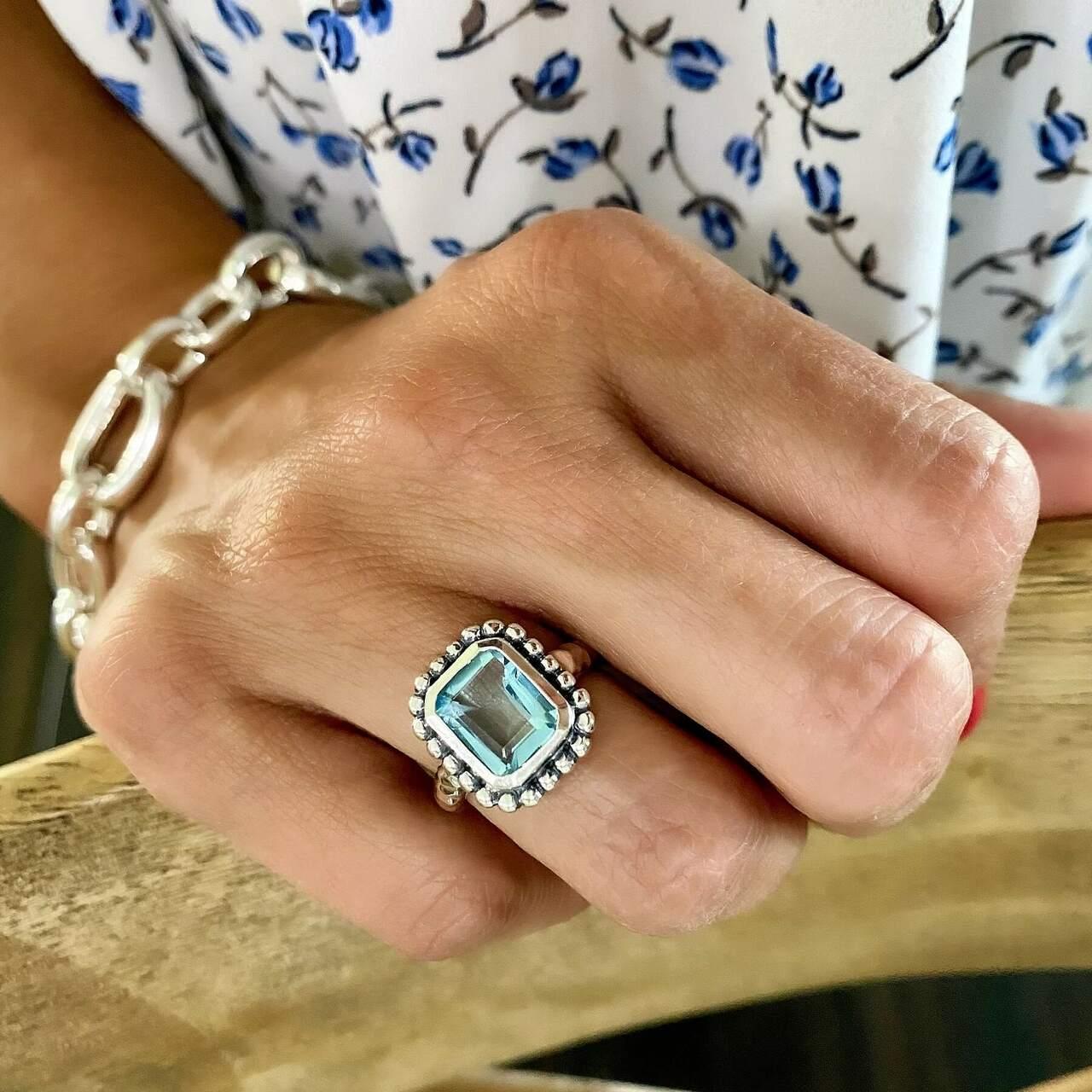 Designer ring in sterling silver and center sky blue CZ