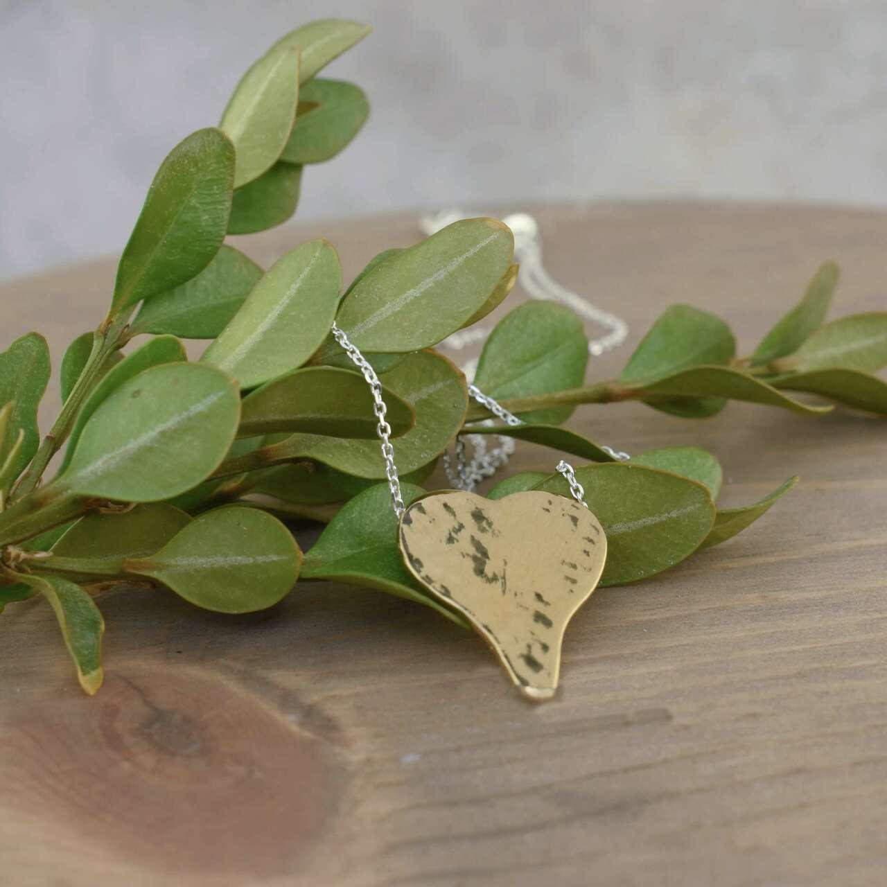 .925 sterling silver mixed metal necklace with elongated heart pendant 